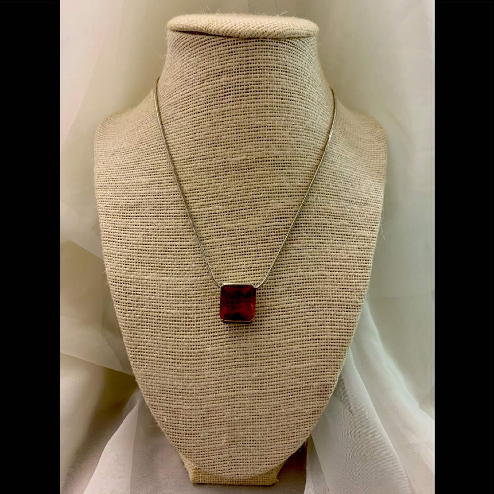 Silver necklace with a beautiful brown crystal